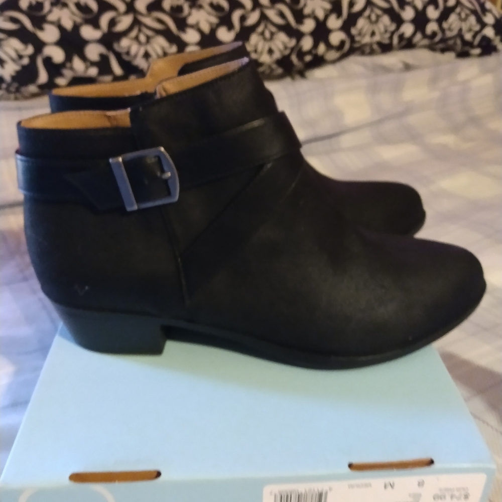 Black low heal zip up booties..silver buckle detail
